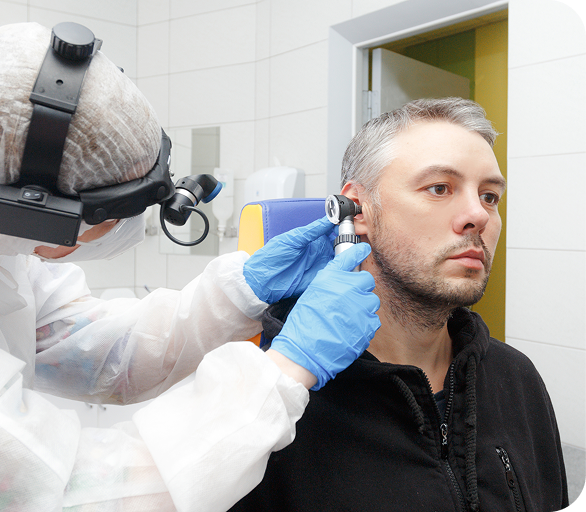 Patient's ear being evaluated at an Urgent Care